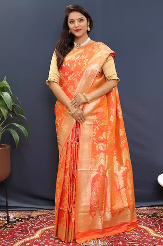 Orange banarasi silk blend saree with all-over gold zari floral jaal