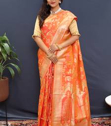Orange banarasi silk blend saree with all-over gold zari floral jaal