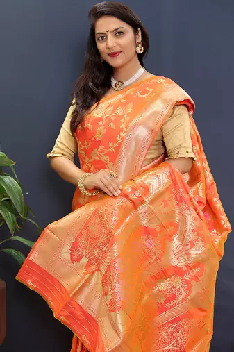 Orange banarasi silk blend saree with all-over gold zari floral jaal