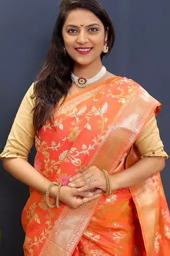 Orange banarasi silk blend saree with all-over gold zari floral jaal