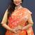 Orange banarasi silk blend saree with all-over gold zari floral jaal