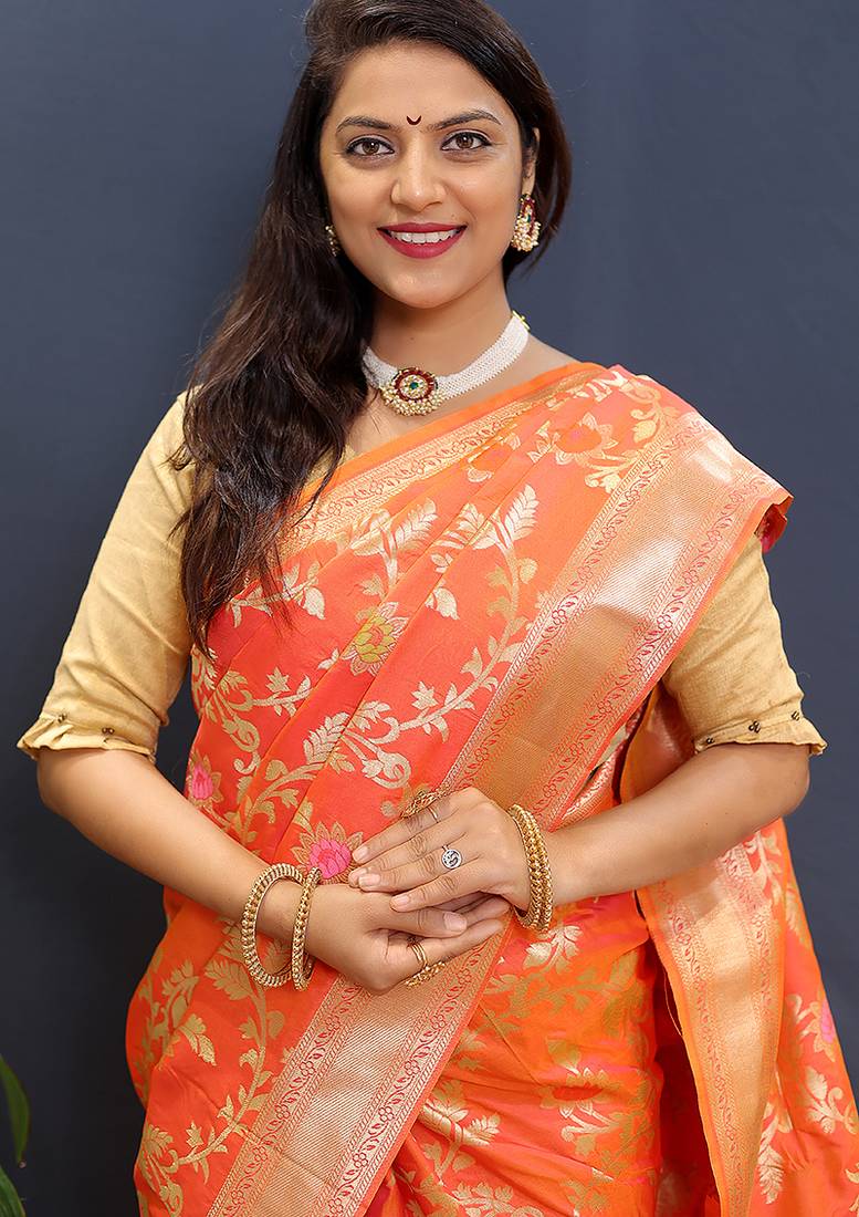 Orange banarasi silk blend saree with all-over gold zari floral jaal