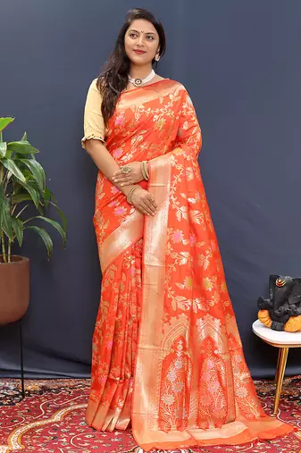 Orange banarasi silk blend saree with all-over gold zari floral jaal