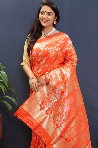 Orange banarasi silk blend saree with all-over gold zari floral jaal