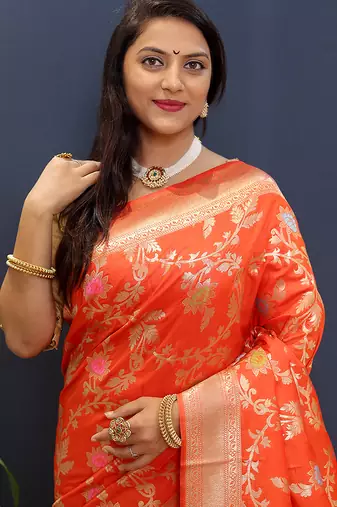 Orange banarasi silk blend saree with all-over gold zari floral jaal