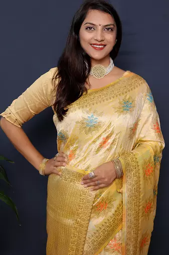 Cream banarasi silk blend saree with  zari floral buta work