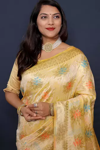 Cream banarasi silk blend saree with  zari floral buta work