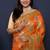 Orange banarasi silk blend saree with  zari floral buta work