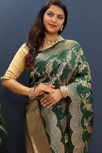 Dark green banarasi silk blend saree with gold zari floral weaving & rich pallu