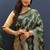 Dark green banarasi silk blend saree with gold zari floral weaving & rich pallu