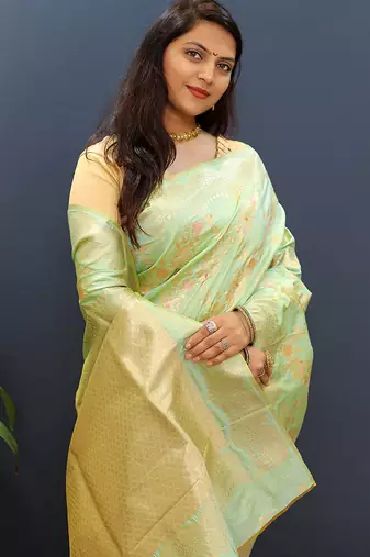 Mint green banarasi silk blend saree with gold zari floral weaving & rich pallu