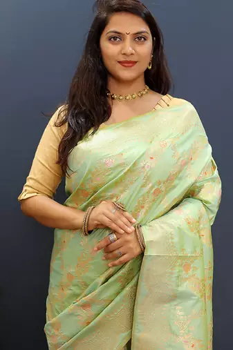Mint green banarasi silk blend saree with gold zari floral weaving & rich pallu