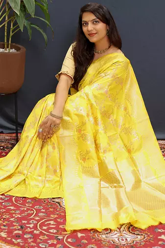Yellow banarasi silk blend saree with gold zari floral weaving & rich pallu