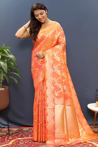 Peach banarasi silk blend saree with gold zari floral weaving & rich pallu