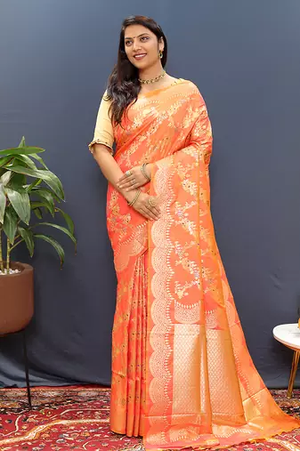Peach banarasi silk blend saree with gold zari floral weaving & rich pallu