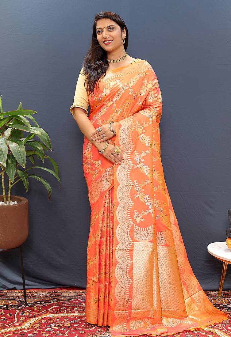 Peach banarasi silk blend saree with gold zari floral weaving & rich pallu