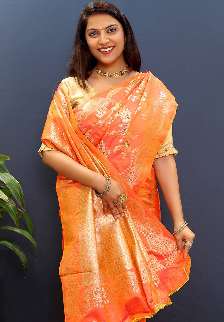 Peach banarasi silk blend saree with gold zari floral weaving & rich pallu