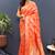 Orange banarasi silk blend saree with gold zari floral weaving & rich pallu