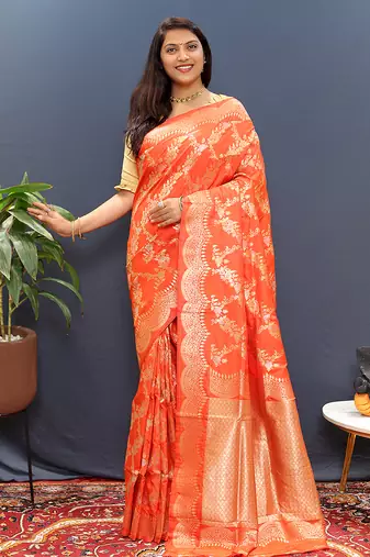 Orange banarasi silk blend saree with gold zari floral weaving & rich pallu