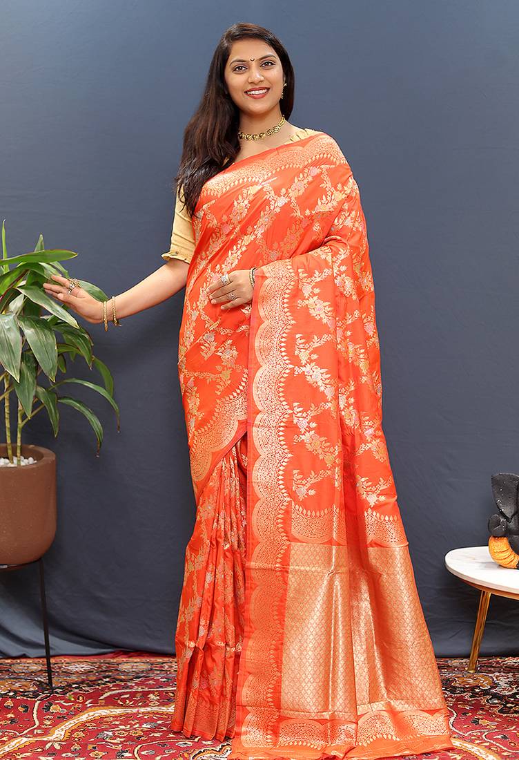 Orange banarasi silk blend saree with gold zari floral weaving & rich pallu