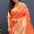 Orange banarasi silk blend saree with gold zari floral weaving & rich pallu