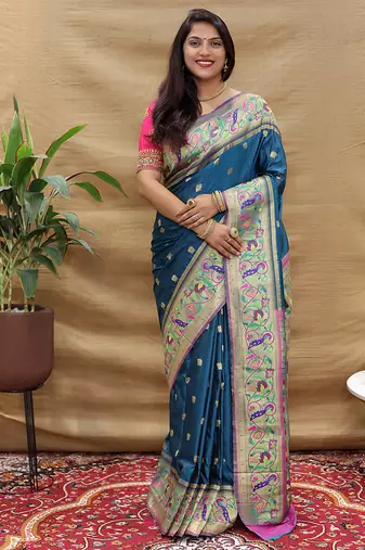 Teal blue paithani silk blend saree with peacock floral border & rani pink blouse