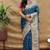 Teal blue paithani silk blend saree with peacock floral border & rani pink blouse