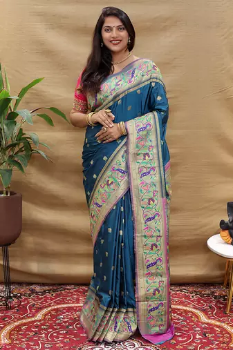 Teal blue paithani silk blend saree with peacock floral border & rani pink blouse