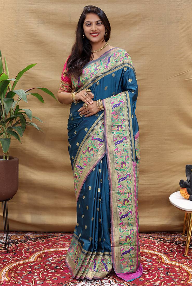Teal blue paithani silk blend saree with peacock floral border & rani pink blouse