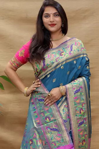 Teal blue paithani silk blend saree with peacock floral border & rani pink blouse