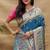 Teal blue paithani silk blend saree with peacock floral border & rani pink blouse