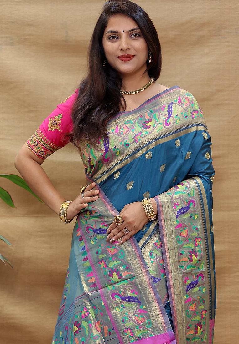 Teal blue paithani silk blend saree with peacock floral border & rani pink blouse
