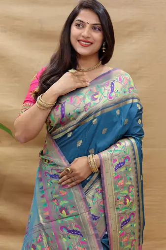 Teal blue paithani silk blend saree with peacock floral border & rani pink blouse