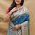 Teal blue paithani silk blend saree with peacock floral border & rani pink blouse