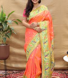 Peach paithani silk blend saree with peacock floral border & rani pink blouse