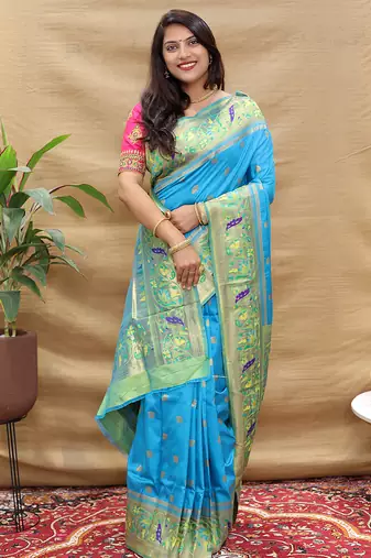 Aqua blue paithani silk blend saree with peacock floral border & rani pink blouse