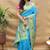 Aqua blue paithani silk blend saree with peacock floral border & rani pink blouse
