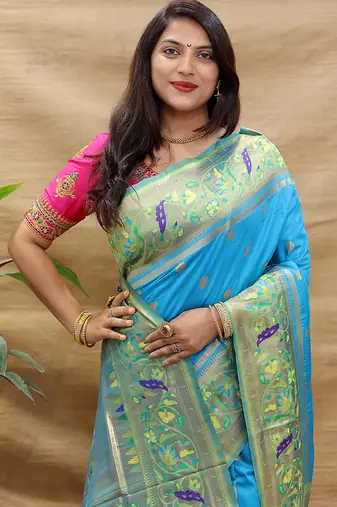 Aqua blue paithani silk blend saree with peacock floral border & rani pink blouse
