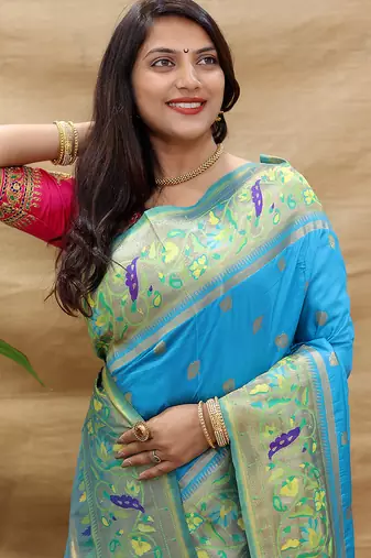 Aqua blue paithani silk blend saree with peacock floral border & rani pink blouse