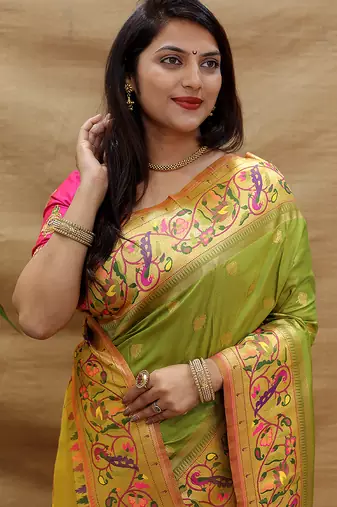 Mehendi green paithani silk blend saree with peacock floral border & rani pink blouse