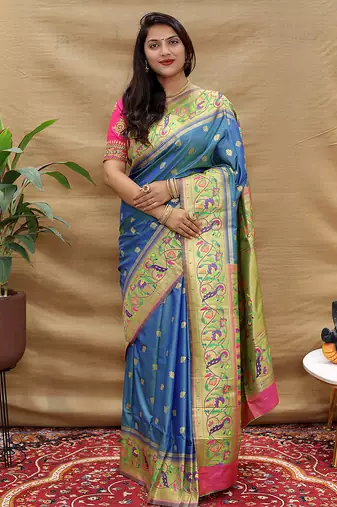 Royal blue paithani silk blend saree with peacock floral border & rani pink blouse