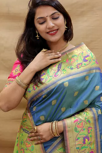 Royal blue paithani silk blend saree with peacock floral border & rani pink blouse