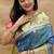 Royal blue paithani silk blend saree with peacock floral border & rani pink blouse
