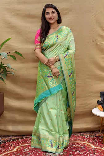 Mint green paithani silk blend saree with peacock floral border & rani pink blouse