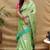 Mint green paithani silk blend saree with peacock floral border & rani pink blouse