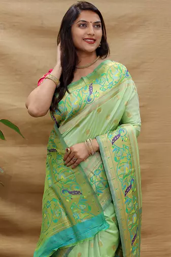Mint green paithani silk blend saree with peacock floral border & rani pink blouse