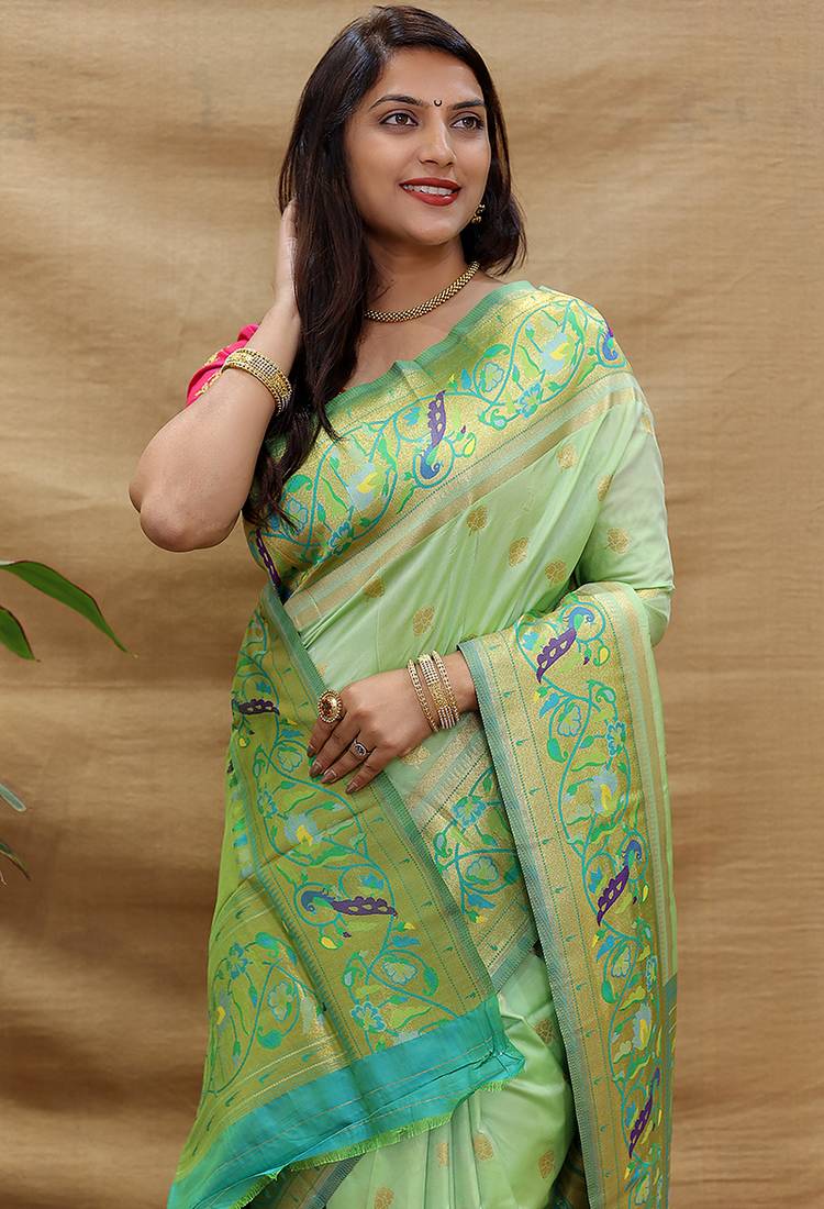 Mint green paithani silk blend saree with peacock floral border & rani pink blouse