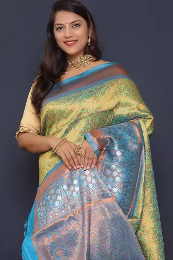 Light green banarasi silk blend saree with sky blue zari border & woven pallu