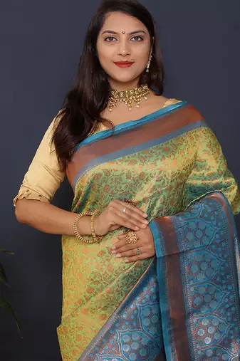 Light green banarasi silk blend saree with sky blue zari border & woven pallu