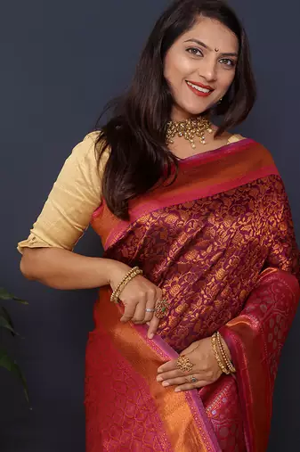 Wine banarasi silk blend saree with rani pink zari border & woven pallu